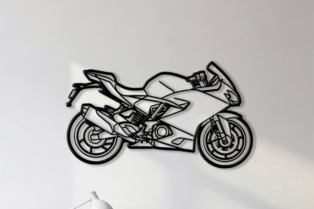 Motorcycle cutout shape made of black metal hanging on the wall
