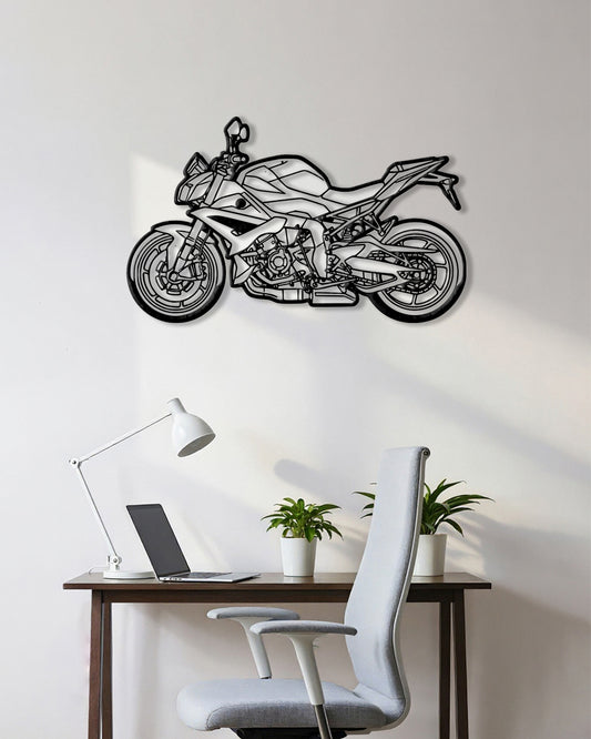 Motorcycle cutout shape made of black metal hanging on the wall
