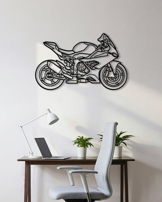 Motorcycle cutout shape made of black metal hanging on the wall