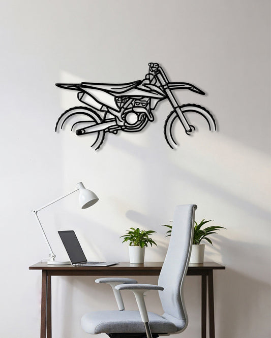 Motorcycle cutout shape made of black metal hanging on the wall
