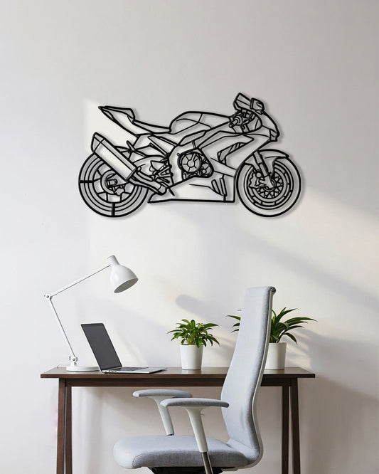 Motorcycle cutout shape made of black metal hanging on the wall