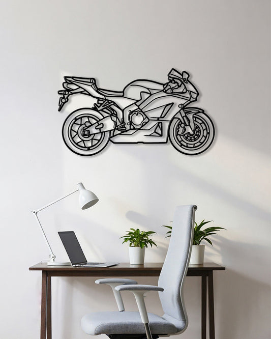 Motorcycle cutout shape made of black metal hanging on the wall