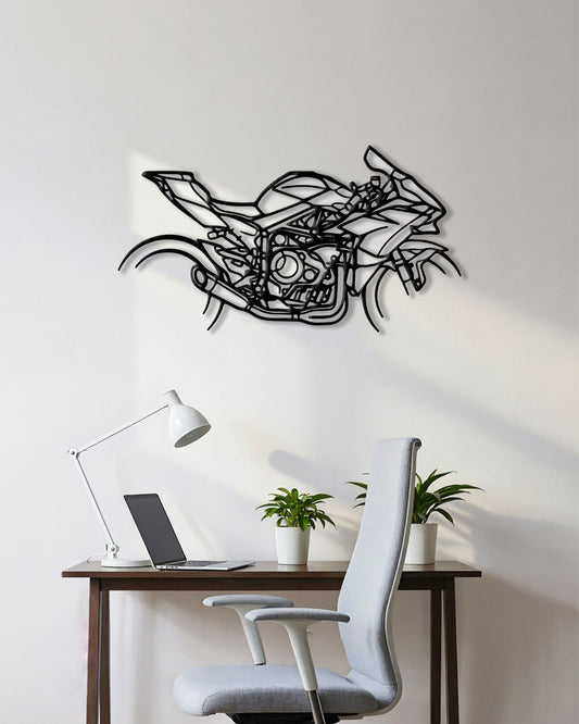 Motorcycle cutout shape made of black metal hanging on the wall