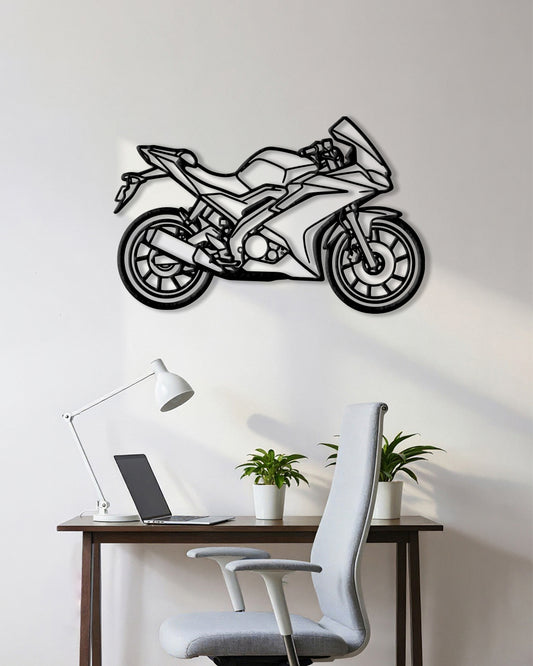 Motorcycle cutout shape made of black metal hanging on the wall