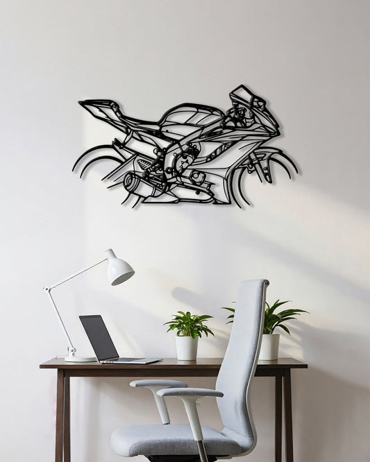 Motorcycle cutout shape made of black metal hanging on the wall