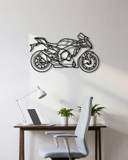 Motorcycle cutout shape made of black metal hanging on the wall