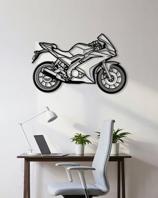 Motorcycle cutout shape made of black metal hanging on the wall